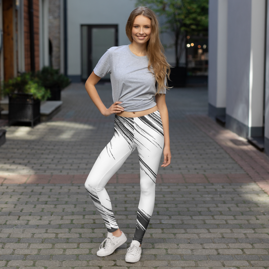 Woman wearing a gray crop top and black and white leggings with brand logo 'Funwearcode' standing on a sidewalk.