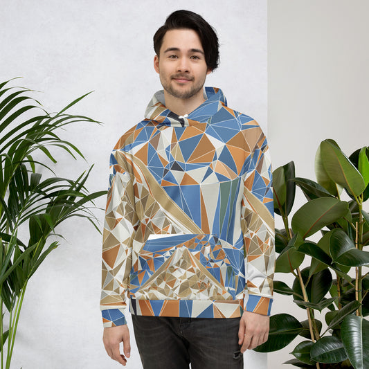 Man wearing a geometric patterned hoodie standing between two plants against a white wall.