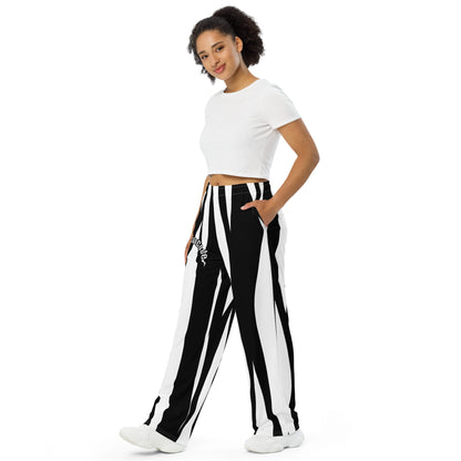 Woman wearing a white crop top and black and white striped pants  with a 'Fun Wear Code' text logo on a white background