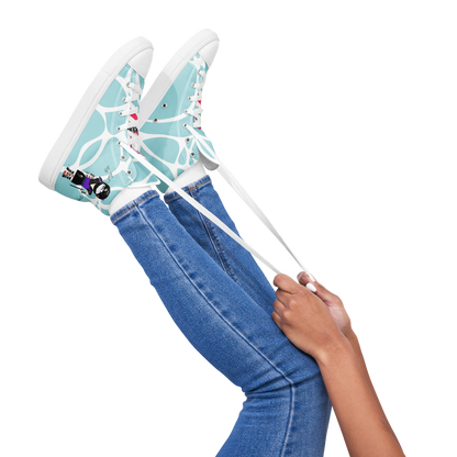 Person wearing light blue high-top sneakers with a lady ninja graphic design on a white background, featuring text 'Last lady ninja'.